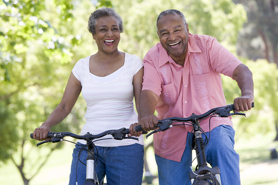 A bicycling couple demonstrating a healthy lifestyle for seniors A bicycling couple demonstrating a healthy lifestyle for seniors