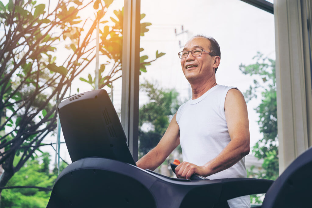 Senior man exercise on treadmill in fitness centerSenior man exercise on treadmill in fitness center