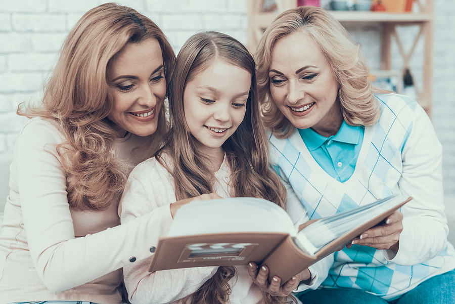 A family looking at a photo album together
