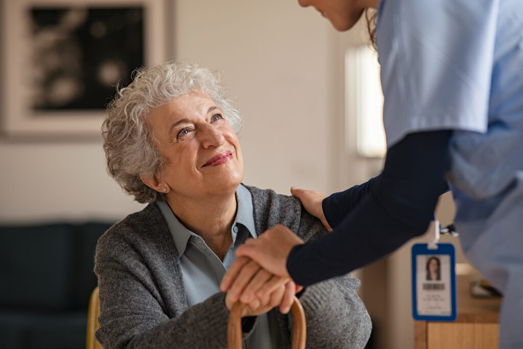 Old woman talking with a nurse